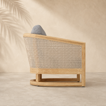 Wooden armchair with woven backrest on a neutral background