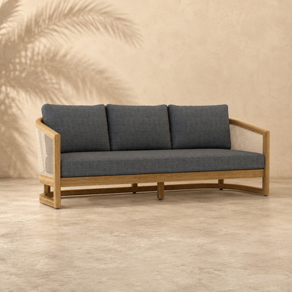 Gray sofa with wooden frame on a beige background