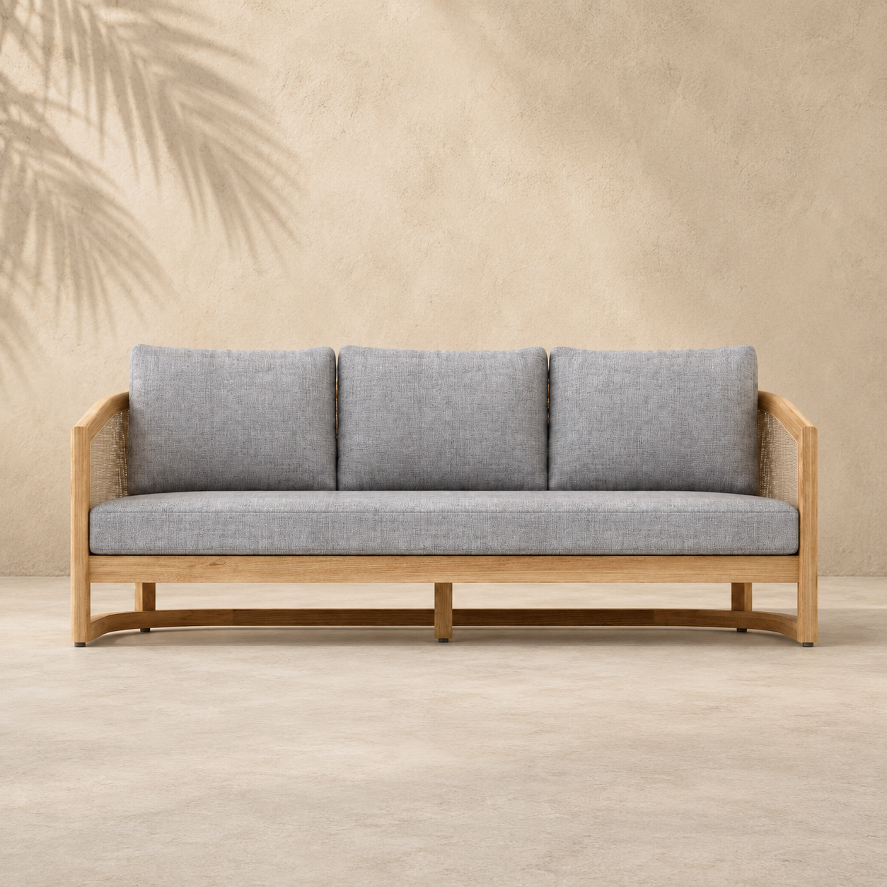 Gray sofa with wooden frame against a beige wall