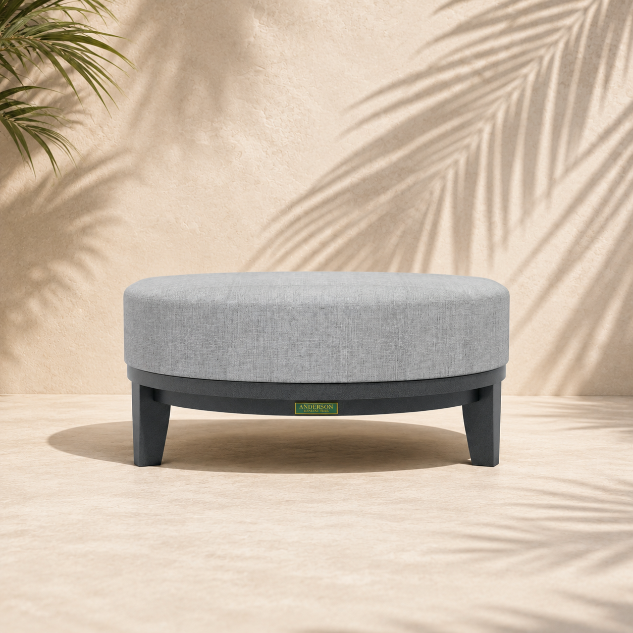 Gray ottoman with a brand logo on a beige background