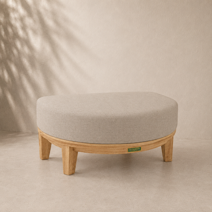 Round ottoman with wooden legs on a beige background