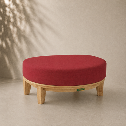 Red cushioned stool with wooden legs on a beige background