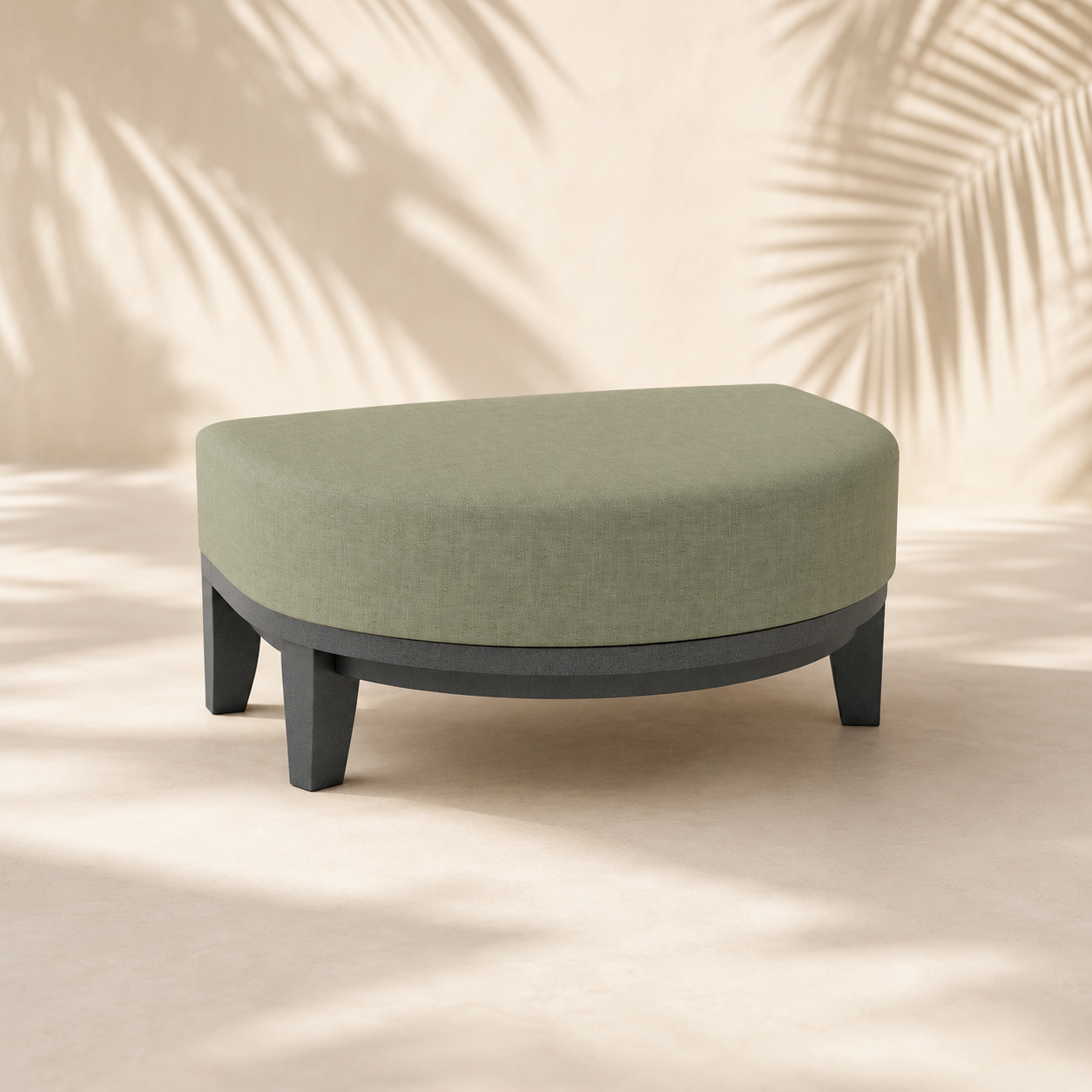 Green ottoman with black legs on a beige background