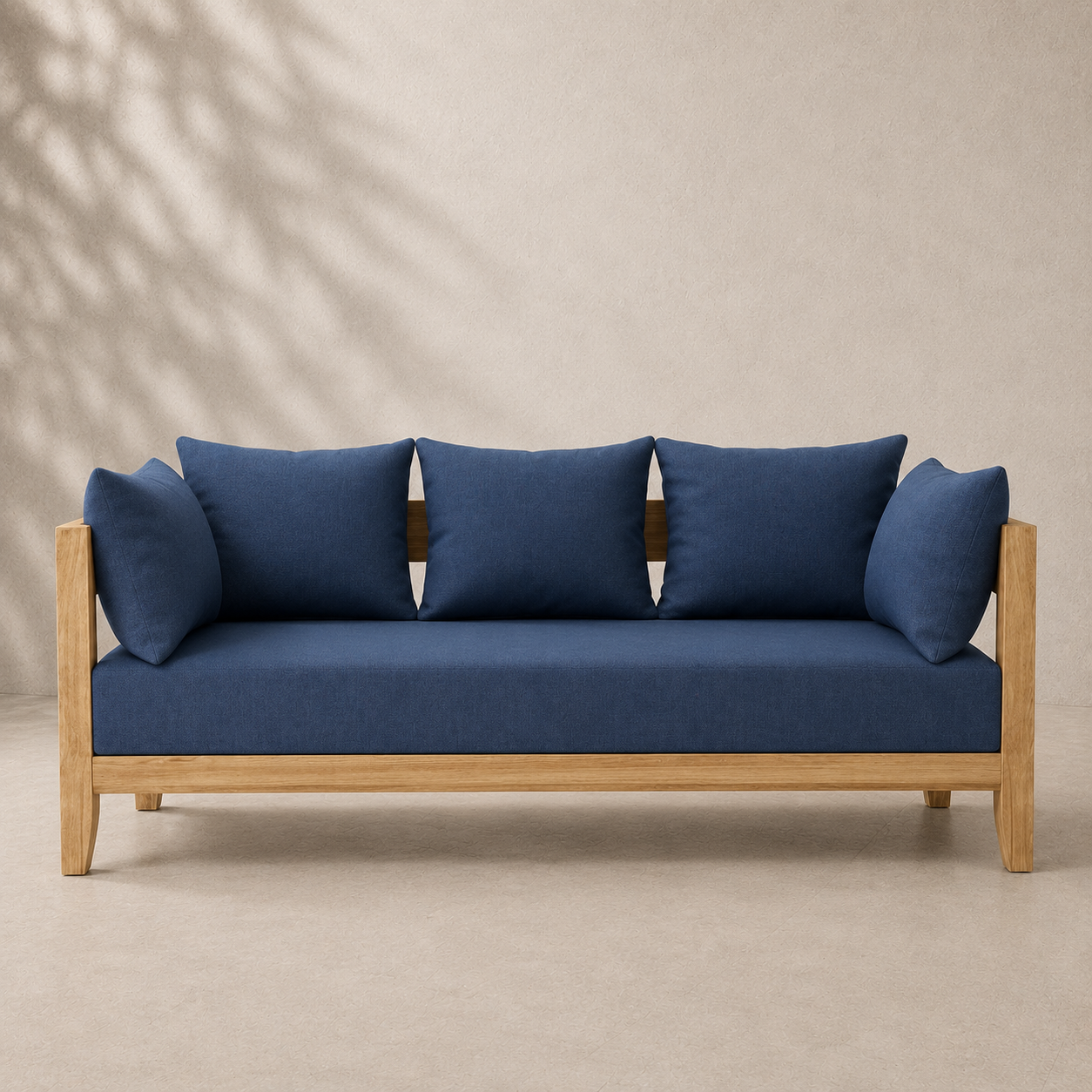 Blue sofa with wooden frame against a beige background