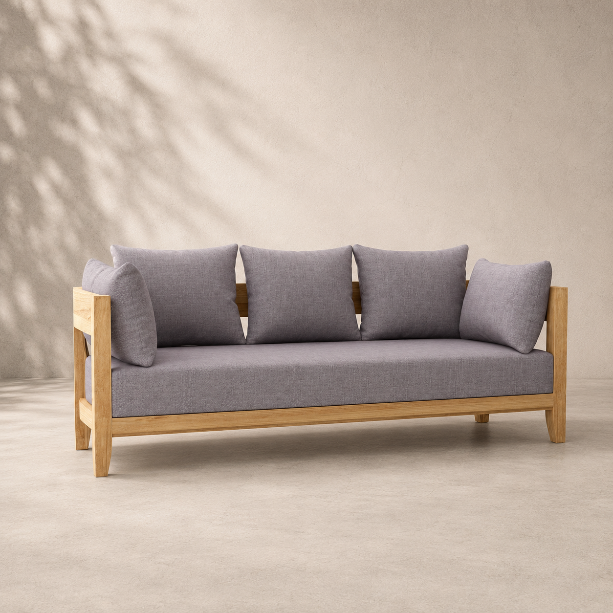Gray sofa with wooden frame against a beige wall