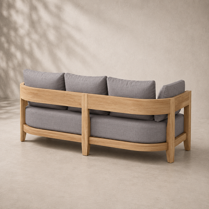 Wooden sofa with gray cushions on a beige background