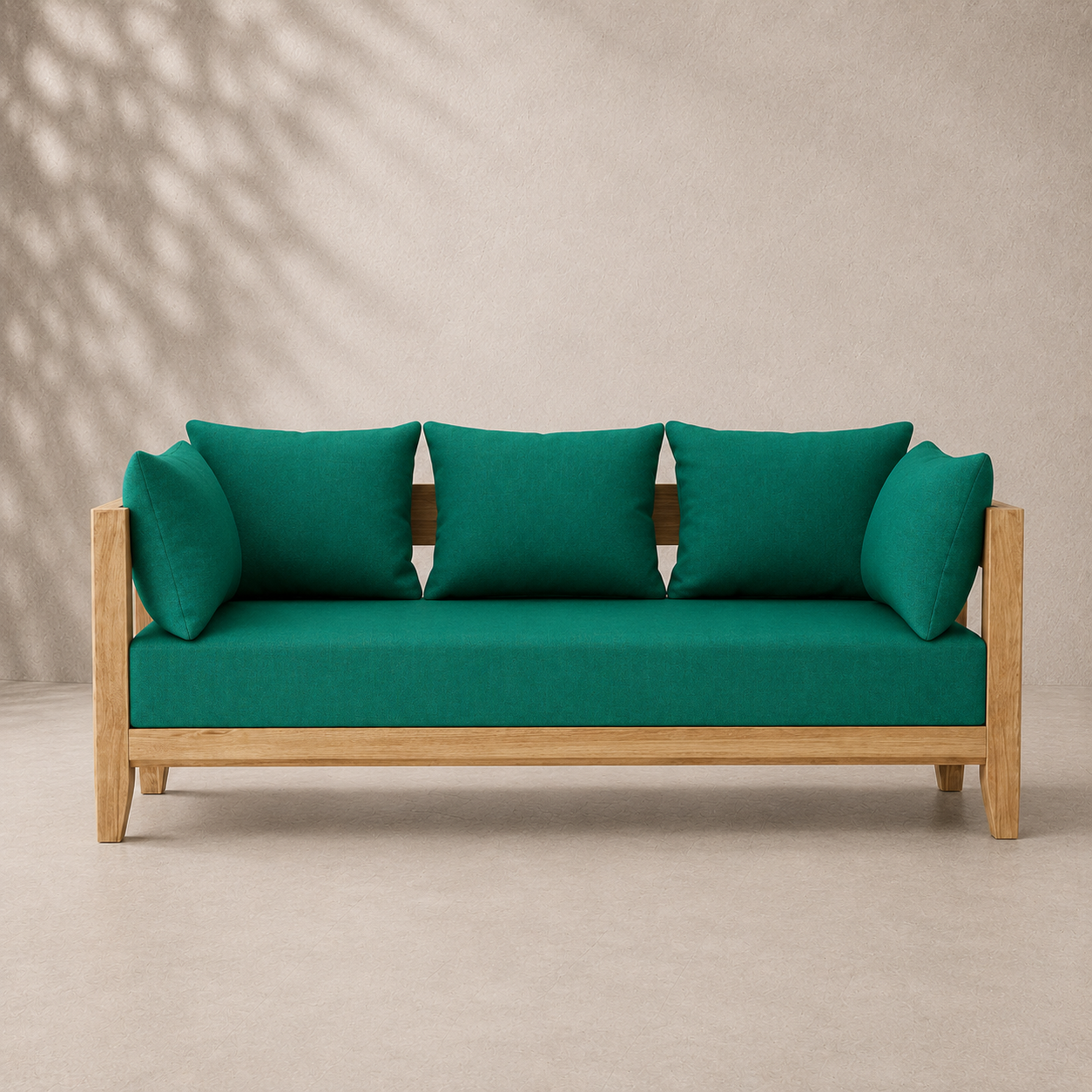 Teal sofa with wooden frame against a beige wall