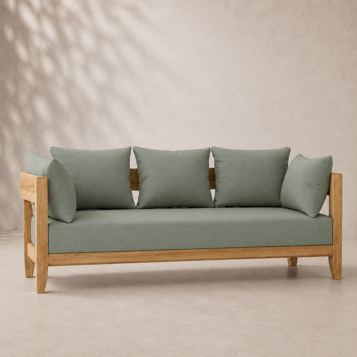 Sofa with wooden frame and green cushions on a beige background