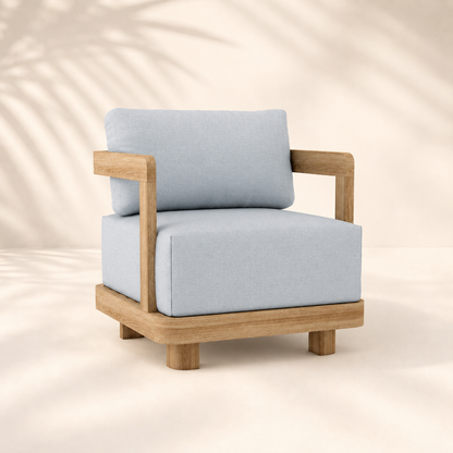 Chair with light blue cushions and wooden frame on a beige background