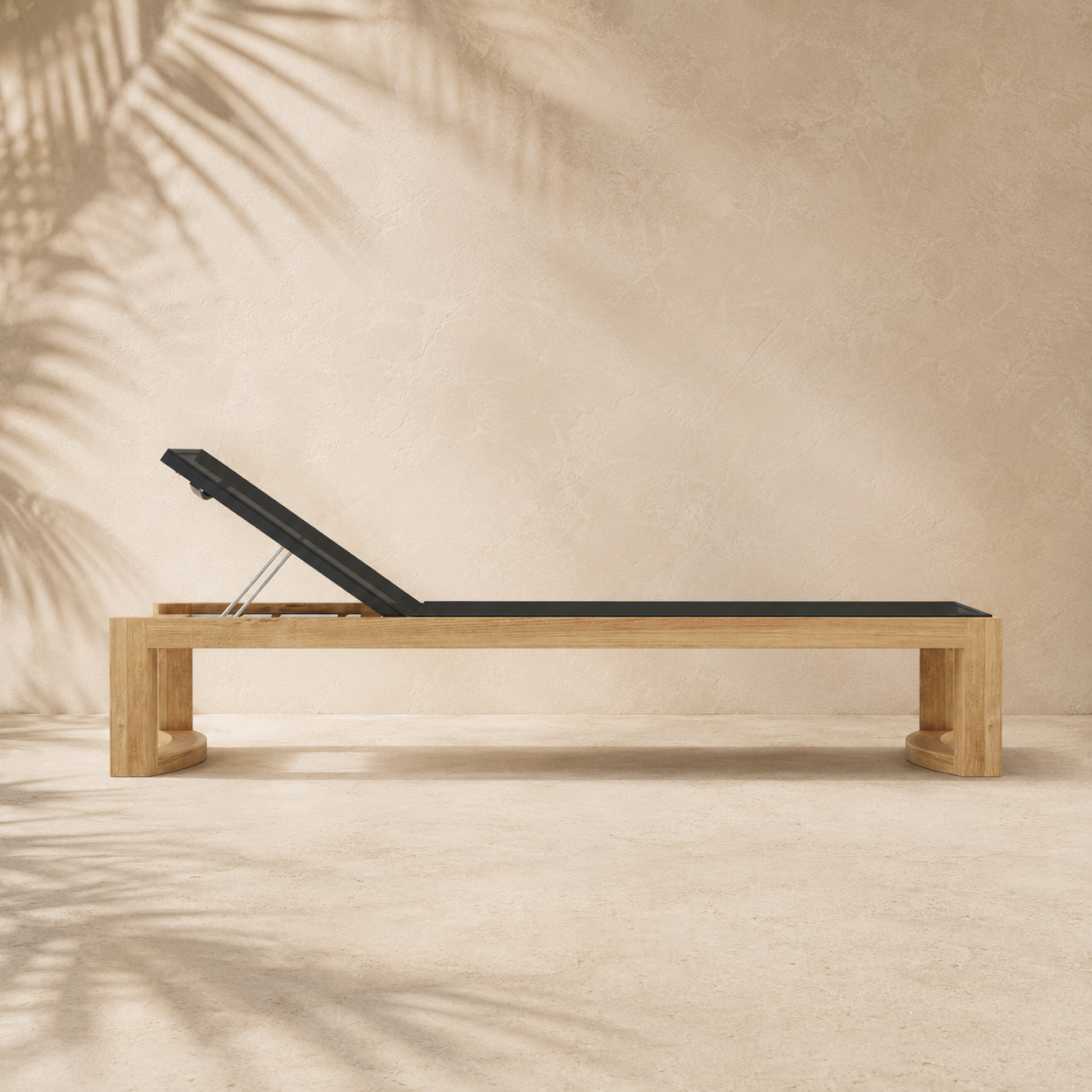 Wooden sun lounger with black cushion on a beige background